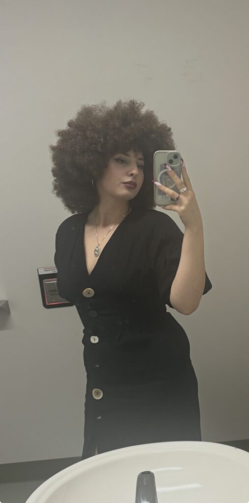 An Image of Lindsey Halpern in a blue dress to add context and visual aid to the text beneath